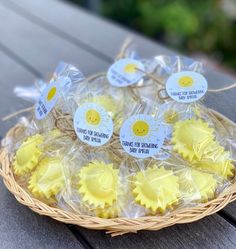 sun cookies wrapped in cellophane on a picnic table with tags attached to them