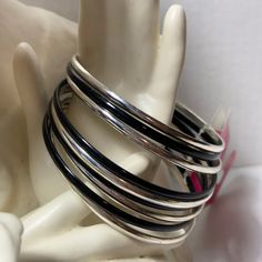 Black And Silver Metal Bracelets Nickel-free Black Bracelets For Party, Nickel-free Black Bracelet For Party, Party Black Nickel-free Bracelets, Black Stackable Bangle Bracelets, Black Stackable Bracelet, Modern Black Metal Bangle, Nickel Free Black Bangle Jewelry, Nickel-free Black Bangle Jewelry, Black Stackable Bangle Jewelry