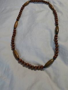 Metal and Clasp Free, 28 inch Wooden Beaded Necklace, Dark Brown Beads with Brown Oval Beads, Costume Jewelry, Fashion Accessory This is a nice find and priced to sell.  Very decorative.  This appears to not have any flaws. Check out our shop for monthly specials. We have a variety of items for every taste. Combine several of our items together to save on shipping. If you have any questions please do not hesitate to ask. I will ship outside of the US, just request a quote. Happy Shopping. I will work around the priority mail price. Just send me your zip code and I will get a quote. As shop owners we will do our best to describe any issues or problems with our items. Since we do sell vintage and antiques there may be some flaws. Please check out the pictures very carefully and feel free to Brown Beaded Necklace With Colorful Oval Beads, Brown Beaded Necklaces With Oval Beads, Brown Beaded Necklace With Oval Beads, Brown Necklaces With Colorful Oval Beads, Adjustable Beaded Necklace With Polished Oval Beads, Adjustable Brown Beaded Necklaces With Oval Beads, Adjustable Brown Oval Beads, Brown Necklaces With Polished Oval Beads, Brown Wooden Beads Oval Jewelry