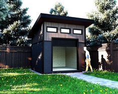 a man walking past a small shed in the grass