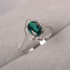 ◆ The ring is handcrafted from sterling silver and decorated with a dazzling 6*8 mm lab grown emerald. It is suitable for engagement/anniversary/daily occasion. ◆ Production Description: Main stone Type: Lab grown emerald Main Stone Shape: Oval cut Main Stone Size: 6*8 mm(1.13ct) Side stone: CZ Metal: 925 Sterling silver - Other options available in the drop down menu ◆ Customization: √Add Engraving √Other Metal Type Available √Other Gemstones & Shapes Available √Personalization Requests Availab Emerald Ring Vintage Silver, Elegant Silver Emerald Ring For Proposal, Silver Oval Emerald Ring For Proposal, Oval Silver Emerald Ring For Proposal, Silver Emerald Engagement Ring, Emerald Engagement Ring Silver, Vibe Outfits, Antique Emerald Ring, Emerald Engagement Ring Green