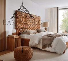 a bedroom with a large bed and wooden headboard on the wall next to a window