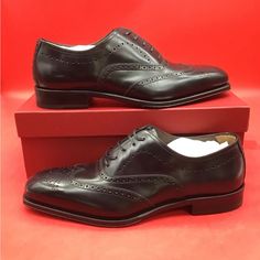 New Elongated And Elegant Proportions Define The Poveda Oxford Shoe From Ferragamo. Crafted From Soft Calf Leather, These Lace-Up Pair Are Finished With Intricate Broguing On The Toe And Upper, Displaying Expert Craftsmanship And An Element Of British Charm. Composition Outer: Calf Leather 100% Lining: Calf Leather 100% Sole: Calf Leather 100% Includes Box And Dust Bags Size 9.5 Ee (Wide) Classic Leather Shoes With Red Sole For Semi-formal Occasions, Classic Leather Shoes With Red Sole For Semi-formal Events, Classic Semi-formal Leather Shoes With Red Sole, Elegant Black Oxfords With Red Sole, Elegant Oxfords With Red Sole And Plain Toe, Elegant Wingtip Oxfords With Red Sole, Italian Luxury Black Oxfords, Luxury Red Sole Oxfords For Semi-formal Occasions, Luxury Oxfords With Red Sole For Semi-formal Occasions