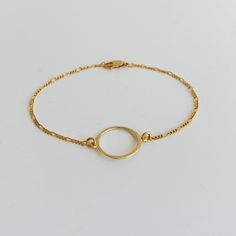 Our karma circle chain bracelet is the sweetest reminder of a close connection with someone special. Inspired by the circle of karma, it symbolizes friendship, unity, and love. -- available in 14k gold filled karma circle: gold plated sterling silver / 20 mm chain link: Figaro bracelet length: adjustable to 7.5" Everyday Hypoallergenic Chain Bracelet, Everyday Gold Bracelet With Delicate Chain, Gold Circle Bracelets For Everyday, Minimalist Round Gold Bracelet For Everyday, Minimalist 14k Gold Filled Chain Bracelet, Everyday Minimalist Gold Bracelet, Minimalist Gold Bracelet With Delicate Chain, Delicate Round Chain Bracelet For Everyday, Everyday Delicate Round Chain Bracelet