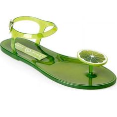 Polyvinyl Chloride Upper. Buckle Closure. Round Toe. Electroplated Gold Seashell Motif. Polyvinyl Chloride Outsole. Imported. Shoe Weight: 0.5 Oz. Lime Scented Bin: 6 Lime Accessories, Jelly Flats, Bow Sandals, Jelly Sandals, Metallic Blue, Strappy Sandals, Katy Perry, Green Fashion, Women's Shoes Sandals