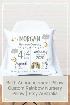 the birth announcement pillow is shown on a chair