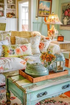 a living room filled with lots of furniture and flowers on top of a coffee table