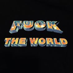 the words chuck and the world are printed on a black t - shirt with an orange, yellow, and blue design