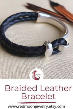 the braided leather bracelet is made with two different types of leather and silver clasps