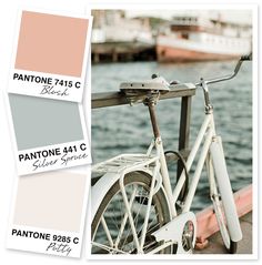 a bike parked next to the water with pantone's paint swatches on it