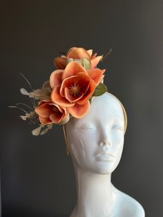 Orange fascinator headpiece with elegant magnolia or orchid flowers on top of gold tulle, perfect for tea parties, derby events, and other special occasions! Thank you for supporting small businesses and we hope our products bring you and your loved ones Joy & Happiness! S H I P P I N G  -   Last minute masquerade mask shopping? 24 hr processing available. Pick appropriate shipping method and leave us checkout note! 1-2 day guaranteed delivery services also offered, add items to cart and click on shipping tab for rates.  Pls leave a check out note with your need date & contact number (especially for expedited and custom orders) Msg for delivery time frames (Include your state/country). S I Z E Adult size. Detailed dimensions are available upon request. C O N T A C T Text: 1-516-654-4643 Em Elegant Flower Hair Accessories For Spring, Elegant Flower Headpieces For Spring, Elegant Spring Flower Hair Accessories, Flower-shaped Fascinator With Handmade Flowers For Garden Party, Handmade Flower Fascinator For Garden Party, Spring Adjustable Fascinator With Handmade Flowers, Spring Headpiece With Handmade Flowers And Structured Crown, Handmade Flower Shape Fascinator For Garden Party, Adjustable Flower Shaped Fascinator For Garden Party