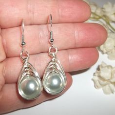 Wire Wrap Earrings Grey Pearl Silver Beaded Handmade Dangle Drop Jewelry C355 This Costume Jewelry Beaded Earring Set Are Brand New Nwt And Handmade By Me - Wvluckygirl. Handcrafted With Gray Acrylic Faux Pearl Beads. These Were Wire Wrapped With Silver Toned Tarnish Resistant Wire To Form A Basket Weave Around The Beads. The Pair Dangle And Drop From 925 Sterling Silver French Fishhook Ear Wires For Her Pierced Ears. From Top To Bottom They Measure 1 3/4 Inches Tall And Just Over 1/2 Inch Wide. Wire Earrings Handmade Unique, Silver Teardrop Earrings With Pearl Drop For Party, Silver Teardrop Pearl Earrings For Party, Elegant Metal Teardrop Earrings With Wire Wrapped Detail, Elegant Metal Teardrop Earrings Wire Wrapped, Elegant Metal Wire Wrapped Teardrop Earrings, Silver Pearl Drop Jewelry, Silver Wire-wrapped Teardrop Earrings, Wire Wrapped Silver Plated Ring For Party