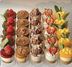 an assortment of desserts are arranged in rows