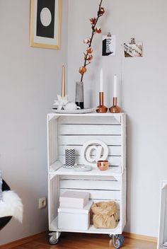 a white shelf sitting on top of a hard wood floor