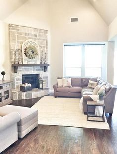 a living room filled with furniture and a fire place