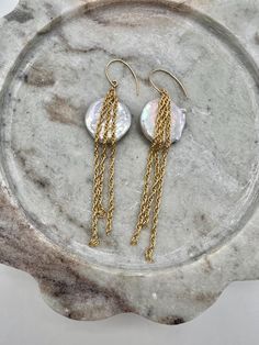 Our Ava Earrings are a striking image of elegance and versatility. Adorned with three 1.5" 14k gold filled rope chains and a white freshwater coin pearl each this pair of earrings can complement any ensemble. We use 14k gold-filled high quality metal manufactured in the US.  All of the jewelry is handmade in my little California studio Coin Pearls, Rope Chain, Earrings Handmade, Freshwater Pearls, Jewelry Earrings Dangle, Gold Filled, Dangle Drop Earrings, Dangle Earrings, Etsy Accessories