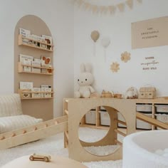 a white room with toys on the floor