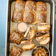 there are many different types of food in the trays on the table, including bread and other foods