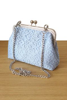 The Baby blue lace Bridal Clutch and Wedding clutch bag are a unique piece of the Olga's Luxury Creation. They will sublimate you during your galas, parties and events. Elegance, style and originality are the key parts of these creations. The use of quality materials, advanced know-how are essential values to offer you the best creations. What are you waiting for to sublimate yourself and being original, come to discover our large collection of evening bags. Wedding clutch bag for Women. Baby bl Luxury Blue Party Shoulder Bag, Cheap Blue Evening Bag For Formal Occasions, Luxury Blue Evening Bag For Events, Luxury Blue Evening Bag For Travel, Luxury Blue Clutch For Gift, Luxury Blue Clutch With Removable Pouch, Cheap Blue Shoulder Evening Bag, Luxury Blue Clutch Evening Bag, Luxury Blue Party Clutch