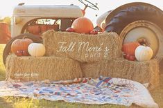 hay bales stacked on top of each other with pumpkins