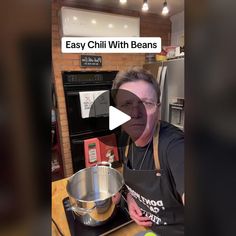 a woman in an apron is making some food on the stove and has her mouth open