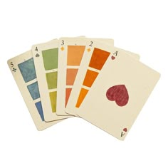 four playing cards with different colors on them