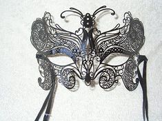 Handmade black laser cut metal mask from Venice, Italy. Ready for decorating.  Add your own art work to these masks. They can be painted, decorated with hot glue, glitter, jewels, feathers etc. Mask has satin ribbons for wearing.  This mask is 7.5 inches wide and 4.5 inches high  Great for classroom projects, group projects, birthday parties etc... Black Fantasy Festival Masks, Black Mardi Gras Masks And Prosthetics, Black Masquerade Mask For Halloween Gift, Black Halloween Masks As Gifts, Black Masks For Halloween Gift, Black Masquerade Mask For Carnival Festival, Artistic Black Masks And Prosthetics For Mardi Gras, Artistic Black Masks For Carnival, Artistic Black Masks And Prosthetics For Carnival