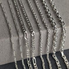 Metal: Premium 925 Sterling Silver Design: Anchor Chain Thickness: 1.70mm - 2.60mm Lengths: Tailored to your preference - Choose from 17.71'' (45cm), 19.68'' (50cm), 21.65'' (55cm), 23.62'' (60cm), 25.59'' (65cm) Design: Figaro Chain Thickness: 1.50mm - 2.10mm Lengths: Tailored to your preference - Choose from 17.71'' (45cm), 19.68'' (50cm), 21.65'' (55cm), 23.62'' (60cm), 25.59'' (65cm) SAFE FOR ALL SKIN TYPES: All our Sterling Silver products are hypoallergenic and nickel free, so they are saf Silver Figaro Chain Necklace Gift, Chain Necklace Silver, Anchor Chain, Figaro Chains, Rolo Chain, Silver Chain Necklace, Necklace Sterling Silver, Necklace Silver, Silver 925