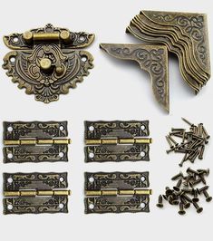 an assortment of antique brass hardware and screws