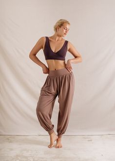 Meet your new favourite everyday pants. The Alora Pants combine comfort and style with their flowy, wide-leg design and oversized fit. Crafted from our super soft Modal Spandex, these pants offer a beautiful drape and incredible softness. Whether you're heading to a yoga class or running errands, these pants will keep you comfortable and relaxed. Flowy wide leg with cuffed hem for a voluminous shape Signature foldover waistband for versatility and comfort Generous hidden side pockets Soft Modal Spandex fabric for elegant draping Yoga Flare Pants, Everyday Pants, Fabric Journals, Beautiful Drapes, Leg Design, Knitwear Cardigan, Yoga Class, Spandex Fabric, Swimwear Tops