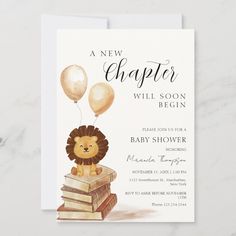 a baby shower with a lion on top of books and balloons in the shape of a balloon