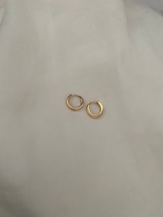 Brand new  *These are for a pair of mini hoops that may be able to fit for seconds and thirds too! They are very small and ear pin needs to be pushed down to click into place when you put them in! COLOURGold SIZE0.9x0.95cm 0.7cm inner Diameter MaterialGold Stainless Steel  Weight4 g Perfect for sensitive ears! Water friendly and tarnish resistant 💌Price includes free untracked shipping within Australia Simple Small Hoop Tarnish Resistant Huggie Earrings, Simple Tarnish Resistant Small Hoop Huggie Earrings, Tiny Hoop Huggie Earrings For Everyday, Tiny Hoop Huggie Earrings Minimalist Style, Tiny Small Hoop Cartilage Earrings For Everyday, Tiny Gold Huggie Earrings Simple Style, Simple Tiny Huggie Earrings, Simple Tiny Gold Huggie Earrings, Everyday Hoop Cartilage Earrings