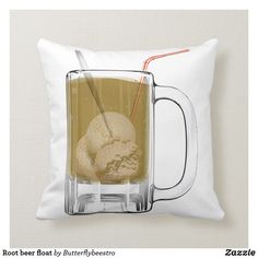 a mug filled with ice cream sitting on top of a pillow