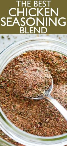 the best chicken seasoning blend in a glass jar with a spoon full of it