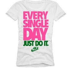 a white shirt with pink and green lettering that says every single day just do it