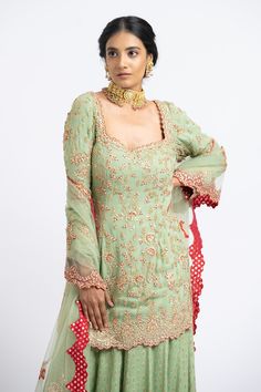 Jade green kurta with floral motifs in gota and bead embroidery. Paired with banarasi woven sharara and embroidered dupatta.
Component: 3
Pattern: Embroidered
Type Of Work: Floral
Neckline: Sweetheart
Sleeve Type: Long Sleeves
Fabric: Georgette, Net
Color: Green
Other Details: 
Tassel detail
Embroidered dupatta
Banarasi woven sharara
Occasion: Wedding - Aza Fashions Kurta Sharara Set, Kurta Sharara, Embroidered Dupatta, Sharara Set, Sweetheart Neck, Bead Embroidery, Floral Motifs, Jade Green, Set For Women