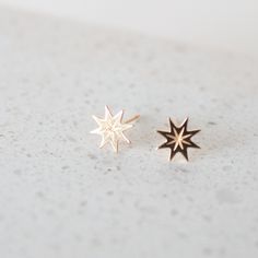 Meet Supernova, your newest little piece of luxury crafted in solid 14k gold. They have a stunning, rich gold color that catches the light in the most mesmerizing way. They have this gorgeous starburst shape that adds a touch of celestial magic to any outfit. The best part is their versatility. You can dress them up for a fancy night out or wear them with a casual jeans and t-shirt combo. They instantly elevate any look and add a touch of elegance and sophistication. It's like having a secret we Dainty Starburst Yellow Gold Jewelry, Celestial Star-shaped 14k Gold Jewelry, 14k Gold Star Shaped Pierced Jewelry, Elegant Starburst 14k Gold Jewelry, Elegant 14k Gold Starburst Jewelry, Celestial 14k Yellow Gold Earrings, 14k Gold Starburst Celestial Jewelry, 14k Gold Celestial Yellow Gold Earrings, 14k Yellow Gold Celestial Earrings