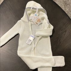 Brand New Sweater Outfit, Super Soft Long Sleeve Onesie For Winter Playtime, Long Sleeve Onesie For Playtime In Winter, Winter Onesie For Playtime, Winter Playtime Solid Onesie, Winter Playtime Solid Color Onesie, White Cotton Winter Onesie, Winter Knitted Long Sleeve Onesie, Fitted Winter Onesie For Playtime, Cozy Hooded White Onesie