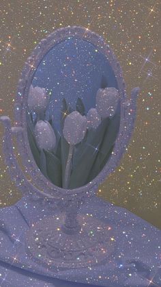 there is a mirror with flowers in it and sparkles all over the surface behind it