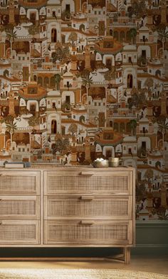 a wooden dresser sitting in front of a wall covered with pictures on it's side