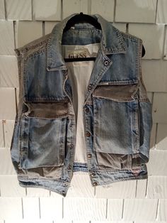 This is a 1980s guess brand all cotton denim vest  amazing front pockets and great vintage condition   ultra cozy Sleeveless Denim Vest With Pockets For Streetwear, Casual Light Wash Vest With Pockets, Medium Wash Vest With Pockets For Fall, Denim Blue Cotton Vest With Pockets, Light Wash Cotton Denim Vest For Streetwear, Cotton Medium Wash Vest Outerwear, Dark Wash Cotton Denim Vest, Light Wash Denim Vest With Pockets For Streetwear, Sleeveless Cotton Denim Vest With Pockets