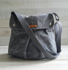 "Combo Messenger in Gray | Special waxed canvas wears like leather Waxed Combo Messenger Bag in Gray makes it easy to take your laptop, files, homework, clothing, and anything else you can stuff into it. Many people use waxed combo messenger bags as their personal carry-on bag for flights to store some extra travel stuff. Highly recommended for ease of use and genuine style, Measurements:( The size can be adjusted, please ask me ) ~14\"across the opening (35 cm), x ~ H 11.5\" (29 cm),x D ~4 \" ( Sailor Bags, Multi Pocket Bag, Waxed Canvas Backpack, Brown Leather Backpack, Canvas Messenger Bag, Waxed Canvas, Day Bag, Messenger Bags, Large Bag