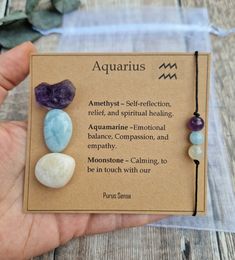 Welcome to Purus Sensa 💚  All of our crystals are hand picked for their quality & beauty.  Please message me any queries, as I'm always happy to help. The gift is designed so that the crystals can be removed safely from the card.  The set includes: 1x raw amethyst 1x aquamarine tumble 1x moonstone tumble 1x handmade gemstone bracelet / anklet  They will arrive in an organza gift bag, gift wrapped and packaged in 100% biodegradable packaging 🌏 There's an option at checkout to add a gift note wh Crystals For Aquarius, Purse Charms Diy, Zodiac Crystals, Best Healing Crystals, Aquarius Gifts, Crystal Dog, Wire Wrapped Stone Jewelry, Reiki Crystals, Biodegradable Packaging