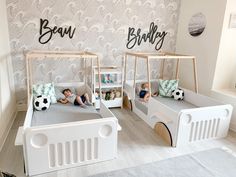 two children's beds with soccer themed wallpaper in the background, and another child's bedroom