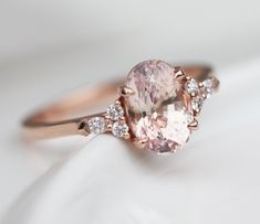 Our Alessandra natural peach sapphire ring with side diamonds will captivate you in a heartbeat. With the prettiest blush peachy shade of the sapphire it compliments every skintone and brings a smile on the face of every woman lucky enough to wear it. It is only fitting to gift this ring as an engagement ring to your loved one.
Details
Main stones

Gemstone: natural peach sapphire from Ceylon
Cut: oval
Carat weight: 2.2ct
Quality: clarity eye clean, very good to excellent cut
Comes with certific Sapphire Ring Rose Gold, Peach Sapphire Rings, Pink Diamond Engagement Ring, Peach Sapphire Engagement Ring, Peach Sapphire, Green Details, White Champagne, Promise Ring Gift, Sapphire Rings