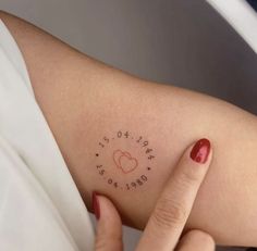 a woman's arm with writing on it that says love is in the air