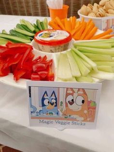 there are many vegetables on the table with some signs in front of them that say magic veggie sticks