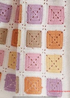 a crocheted blanket with squares on it