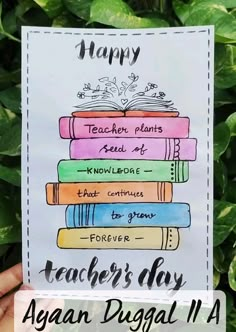 a teacher's day card with books stacked on top of each other in front of green leaves