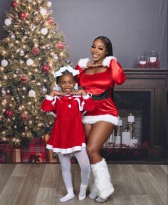 a woman and child dressed up in christmas costumes